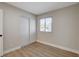 Bright bedroom featuring a window and a closet with sliding doors at 4512 Mark Ave, Las Vegas, NV 89108