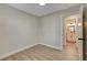 A bright, minimalist bedroom shows the entrance to the ensuite bathroom at 4512 Mark Ave, Las Vegas, NV 89108