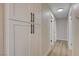 Bright hallway features built-in cabinets and doors with black hardware at 4512 Mark Ave, Las Vegas, NV 89108