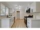 Well-lit kitchen with stainless steel appliances, sleek countertops, and contemporary design, a culinary haven at 4512 Mark Ave, Las Vegas, NV 89108