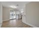 Renovated kitchen adjacent to the dining area, boasting stainless appliances and outdoor access at 4512 Mark Ave, Las Vegas, NV 89108