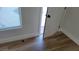 A view of a room with a new door, flooring, and fresh paint at 4512 Mark Ave, Las Vegas, NV 89108