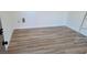 Newly renovated room boasts updated flooring and neutral color scheme for versatile use at 4512 Mark Ave, Las Vegas, NV 89108