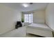 Bright bedroom with a white bed and TV at 4869 S Torrey Pines Dr # 101, Las Vegas, NV 89103