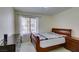 Spacious bedroom with wood sleigh bed and dresser at 4869 S Torrey Pines Dr # 101, Las Vegas, NV 89103