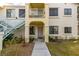 Ground level view of condo building entryway with stairs and landscaping at 4869 S Torrey Pines Dr # 101, Las Vegas, NV 89103