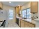 Galley-style kitchen with light cabinets, gas stove, and dishwasher at 4869 S Torrey Pines Dr # 101, Las Vegas, NV 89103