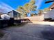 Open patio featuring a storage shed and mature trees at 5266 Lisagayle Ct # 124, Las Vegas, NV 89103