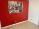 Tile flooring and a bold red accent wall make for an eye-catching space at 5266 Lisagayle Ct # 124, Las Vegas, NV 89103