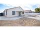 Backyard with a stucco fence, concrete patio and walkway and xeriscape landscaping at 536 Roberta Alecia Ave, North Las Vegas, NV 89031