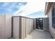 Backyard featuring a neutral-colored storage shed and black iron gate, offering convenient storage at 536 Roberta Alecia Ave, North Las Vegas, NV 89031