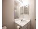 Compact bathroom featuring single sink and mirrored cabinet at 536 Roberta Alecia Ave, North Las Vegas, NV 89031