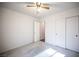 Bedroom with a ceiling fan, closet, and view to another room at 536 Roberta Alecia Ave, North Las Vegas, NV 89031