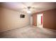 Bedroom with a ceiling fan, TV, and view to the bathroom at 536 Roberta Alecia Ave, North Las Vegas, NV 89031