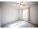 Bedroom with a ceiling fan and window with blinds and curtains at 536 Roberta Alecia Ave, North Las Vegas, NV 89031