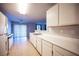 Bright kitchen with white cabinets and appliances, open to dining area at 536 Roberta Alecia Ave, North Las Vegas, NV 89031