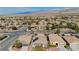 Neighborhood aerial view featuring well-maintained homes with mature trees, desert landscaping and solar panels at 5468 Carrara Pointe St, Pahrump, NV 89061