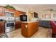 Modern kitchen featuring stainless steel appliances, granite countertops, and a breakfast island at 5468 Carrara Pointe St, Pahrump, NV 89061