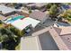 Aerial view showcasing the home with an RV garage, pool, lush landscaping, and covered parking at 5625 W Agate Ave, Las Vegas, NV 89139