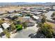 Aerial view of a single-Gathering home featuring an attached two-car garage, desert landscaping, and neighboring homes at 5625 W Agate Ave, Las Vegas, NV 89139