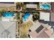 Aerial view of a backyard including a large pool, desert landscaping, patio area, and surrounding single-Gathering homes at 5625 W Agate Ave, Las Vegas, NV 89139