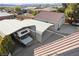 Aerial view of the backyard of a single-Gathering home featuring a detached two-car garage and a carport at 5625 W Agate Ave, Las Vegas, NV 89139