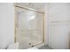 Bathroom with tiled shower and glass enclosure, complemented by a towel rack for convenient storage at 5625 W Agate Ave, Las Vegas, NV 89139