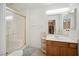 Bathroom with a sink vanity and walk-in shower with a glass door, and safety bars at 5625 W Agate Ave, Las Vegas, NV 89139