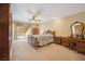 Cozy bedroom with carpet, traditional furniture, and a sliding glass door at 5625 W Agate Ave, Las Vegas, NV 89139