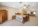 Bedroom showcasing a mirrored closet, ceiling fan, and traditional wooden furniture offering a cozy retreat at 5625 W Agate Ave, Las Vegas, NV 89139