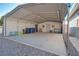 Large carport with concrete slab, and metal structure, providing ample sheltered parking and storage at 5625 W Agate Ave, Las Vegas, NV 89139