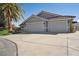 Spacious home featuring a two-car garage, desert landscaping, and a well-maintained driveway at 5625 W Agate Ave, Las Vegas, NV 89139