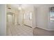 Bright foyer with tile flooring leading to multiple rooms and featuring a front door with sidelights at 5625 W Agate Ave, Las Vegas, NV 89139