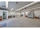 Expansive garage featuring bright lighting, workbenches, and ample space for projects and storage at 5625 W Agate Ave, Las Vegas, NV 89139