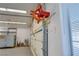 Garage with finished walls, organized storage, a hose reel, and ample space for projects at 5625 W Agate Ave, Las Vegas, NV 89139