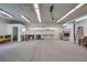 Large garage with abundant lighting, extensive workbenches, and a clean, open layout at 5625 W Agate Ave, Las Vegas, NV 89139