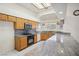 Well-lit kitchen featuring granite countertops, stainless steel appliances, and tile flooring at 5625 W Agate Ave, Las Vegas, NV 89139