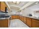 Kitchen with granite countertops, tile flooring, stainless steel appliances, and natural light at 5625 W Agate Ave, Las Vegas, NV 89139