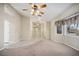 Inviting living room features neutral tones and a ceiling fan for added comfort at 5625 W Agate Ave, Las Vegas, NV 89139