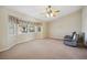 Comfortable living room featuring ceiling fan, bay window, and two recliners for relaxing at 5625 W Agate Ave, Las Vegas, NV 89139