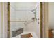 Shower featuring accessible grab bars and built-in seating for comfortable use at 5625 W Agate Ave, Las Vegas, NV 89139