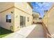 Backyard featuring a concrete patio, a sliding door, and low-maintenance landscaping at 6356 Blue Twilight Ct, Las Vegas, NV 89108