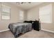 Bedroom with carpet flooring, neutral walls, and natural light from two windows at 6356 Blue Twilight Ct, Las Vegas, NV 89108