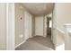 Upstairs hallway featuring neutral walls and carpet, with multiple doors for easy access at 6356 Blue Twilight Ct, Las Vegas, NV 89108