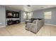 Living room featuring tile floors, a TV, and a comfortable seating area at 6356 Blue Twilight Ct, Las Vegas, NV 89108