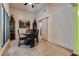 Charming dining area with black table and chairs, and a view to the kitchen at 6520 Brushwood Ln, Las Vegas, NV 89107