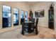 Bright dining area features a black table and chairs, and mirrors at 6520 Brushwood Ln, Las Vegas, NV 89107