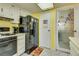 Modern kitchen with black appliances and white cabinets at 6520 Brushwood Ln, Las Vegas, NV 89107