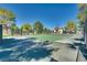 Community tennis court with surrounding trees at 6520 Brushwood Ln, Las Vegas, NV 89107