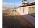 View of the backyard with gravel landscaping and a concrete patio area at 6741 Solaron Ave, Las Vegas, NV 89156